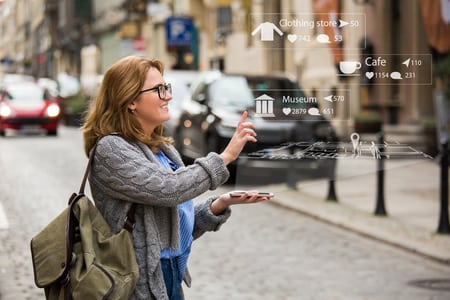 International Traveler Using Helpful Smartphone Apps