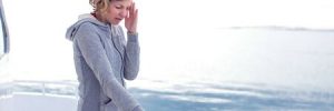 cruise sea motion sickness young tourist woman. seasick on boat vacation with headache. fear of travel or illness virus on cruising holiday