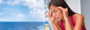Woman feeling seasick on her cruise vacation