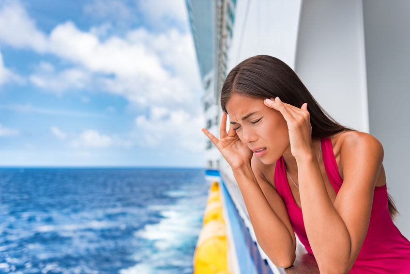 Woman feeling seasick on her cruise vacation