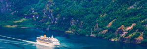 Breathtaking view of Sunnylvsfjorden fjord and cruise ship, near Geiranger village in western Norway.