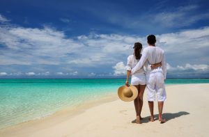 couple on a tropical beach at maldives