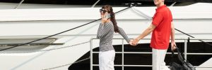 A young couple getting ready to board their first crewed yacht.